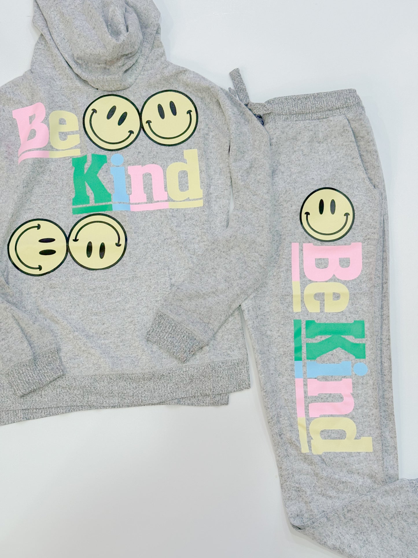 be kind smiley joggers